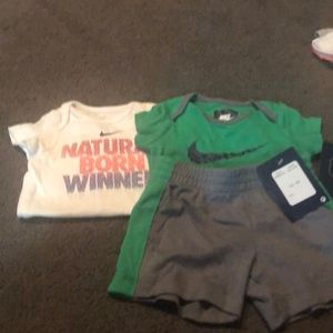 1 Nike set and 1 Nike onesie
